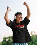 Happy Asian woman in black twerk team tshirt dancing with arms raised and wearing headphones